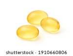 Three golden color oil in soft gel capsule isolated on white background. Clipping path