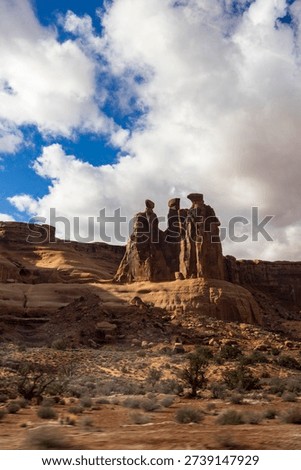 Three Gossips with dramatic clouds. Arches National Park, Moab, Utah. January 2026.