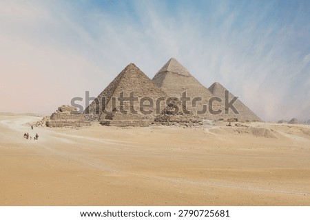The Three Great Pyramids of Giza Complex in the Desert Landscape.
