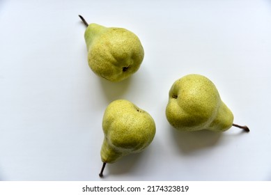 Three green juicy pears on a white background. Abstract template on green background. - Shutterstock ID 2174323819