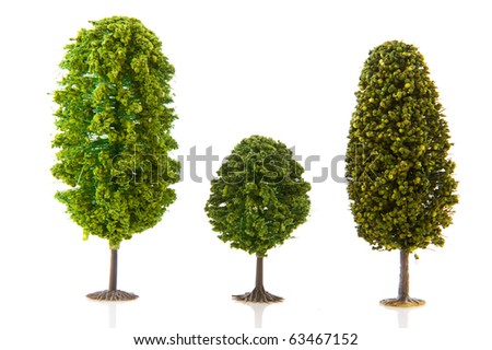 Three green trees in a row isolated over white background