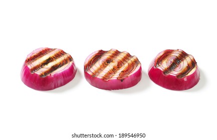 Three Grilled Slices Of Red Onion With Burned Grid