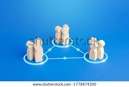 Three groups of people are connected by lines. Cooperation and collaboration, job sharing distribution and globalization. Outsourcing. Combining efforts in a project. Business model concept