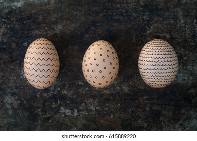 Three hand decorated Easter eggs, happy easter retro concept