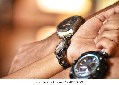 Three hands showing time