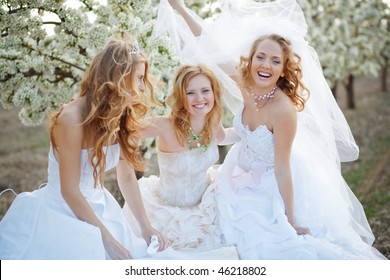 Three happy beautiful brides together