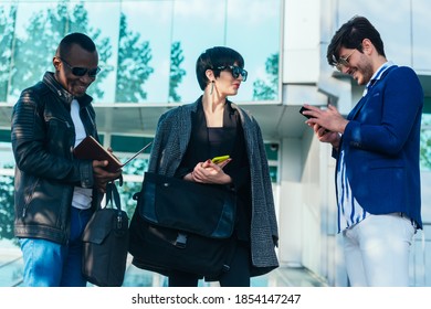 Three Happy Business Colleagues Talking Outside The Office