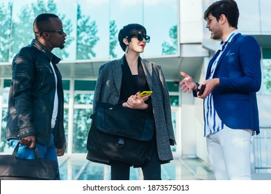 Three Happy Business Colleagues Talking Outside The Office