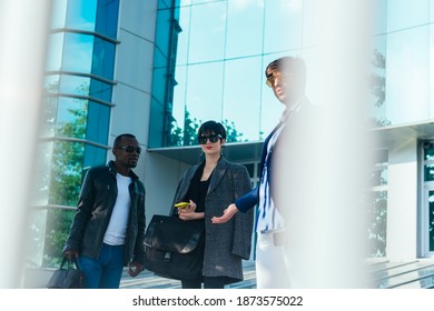 Three Happy Business Colleagues Talking Outside The Office