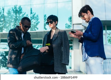 Three Happy Business Colleagues Talking Outside The Office