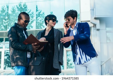 Three Happy Business Colleagues Talking Outside The Office