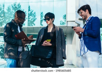 Three Happy Business Colleagues Talking Outside The Office