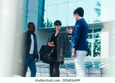 Three Happy Business Colleagues Talking Outside The Office