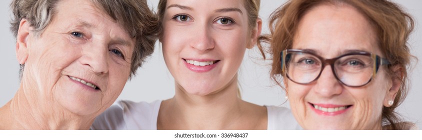 Three happy family women standing together
