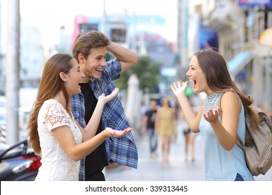 Three happy friends meeting in the sidewalk of a street of a big city with an urban background - Powered by Shutterstock