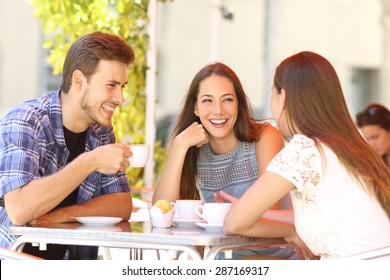Three Happy Friends Talking And Laughing In A Coffee Shop Terrace