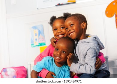 Three Happy Little Black Kids Close Portrait Hug