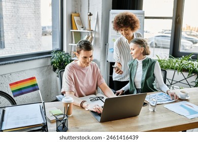 Three hard-working women collaborate at a table in a modern office setting. - Powered by Shutterstock