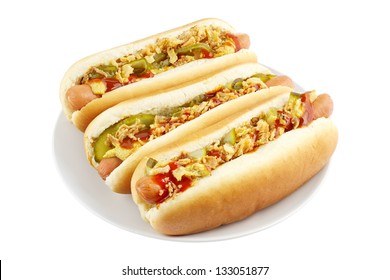 Three Hot Dogs On A Plate Isolated On White