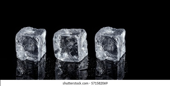 Three Ice Cubes On Black Background