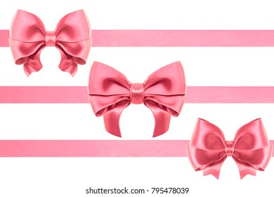 three Invention satin pink ribbon bows with ribbons in different sizes over white background