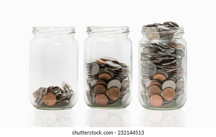 Three jars with different level of coins. - Powered by Shutterstock