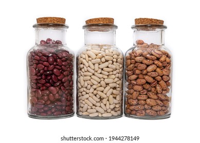 Three Jars Of Dried Beans, White, Borlotti And Kidney Beans Isolated On A White Background.. Dried For Storage And Preservation, Long Shelf Life Nutritional Food.