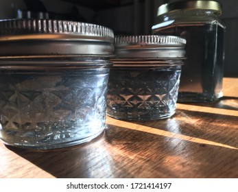 Three Jars Of Violet Syrup