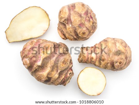 Three Jerusalem artichoke tubers with two halves isolated on white background sweet crisp topinambur top view
 [[stock_photo]] © 