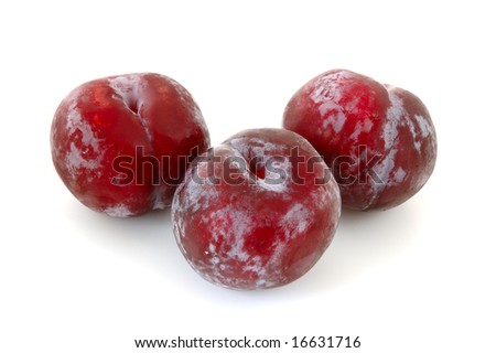 Three juicy lilac plums on overwhite background.