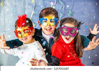 Three Kids Celebrating Carnival  Together At Home