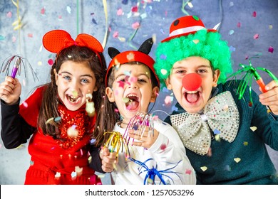 Three kids celebrating Carnival  together at home - Shutterstock ID 1257053296