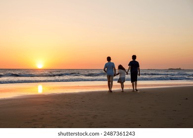 Three kids silhouettes running and jumping on beach at sunset. happy family, two school boys and one little preschool girl. Siblings having fun together. Bonding and family vacation. - Powered by Shutterstock