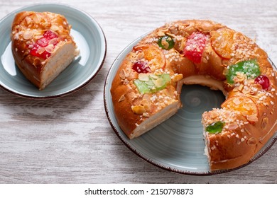 Three Kings Day Cake Or Bread On Rustic Background, Top View. Traditional Seasonal Epiphany Food On Christmas Decorated Table, Top Down, Copy Space