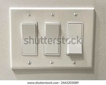 Three large button on and off light switches.