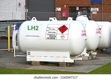 Three large gas cylinders with the letters liquid hydrogen LH2 on the first one - Shutterstock ID 2165047117