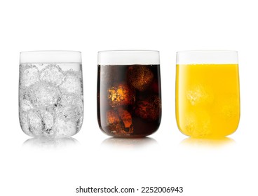 Three large glasses with cola soft drink with orange soda and lemonade.