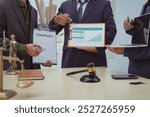 Three lawyers in a meeting at the table in an office, discussing business, civil and commercial law, labor law, marketing and advertising law,offering legal consulting and case management services.