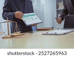 Three lawyers in a meeting at the table in an office, discussing business, civil and commercial law, labor law, marketing and advertising law,offering legal consulting and case management services.