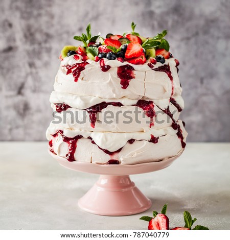 Three Layer Pavlova Cake with Whipped Cream, Raspberry Jam and Assorted Fruit and Berries, square