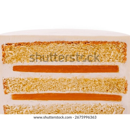 Three layers of moist cake filled with caramel and covered in smooth white frosting sit against a stark white background. The cake showcases its delicious filling with each slice.