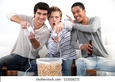 Three Male Teenagers Playing Video Games.