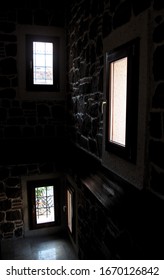 Three medium windows illuminating the darkness