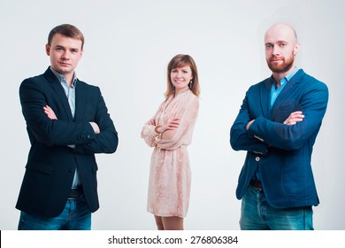 Three Men In Business Suits Talking On A White Background 