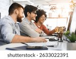 Three men enjoying good coding job on computer at modern office
