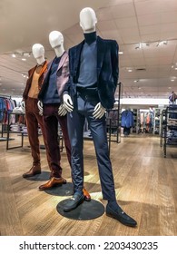  Three Men Mannequins Dressed In Casual Suits In A Department Store Mens Section Standing On A Wooden Floor