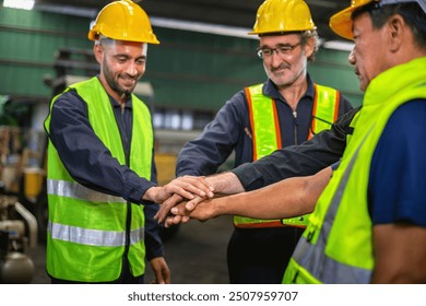 three men in safety vests are shaking hands. Scene is positive and friend - Powered by Shutterstock