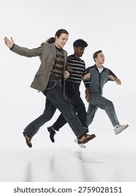 Three men walking in synchronized motion isolated on white background. Concept of teamwork alignment, coordinated action, business process, collaboration flow and group performance.