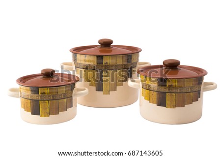Three metal pans with lid and figure isolated on white background