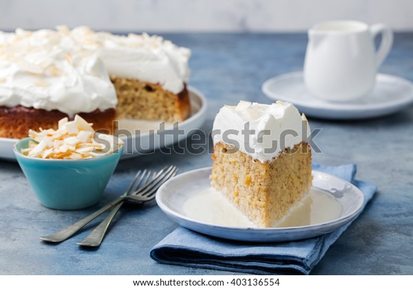 Three milk cake, tres leches cake with\
coconut. Traditional dessert of Latin\
America\
